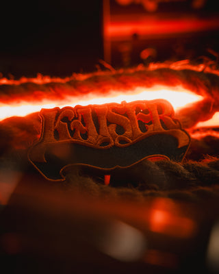 Close-up of a photo of patch with the finnish stoner rock band Kaiser. Produced by Mangobeard.